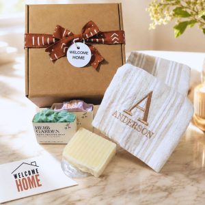 Housewarming gift set. Embroidered kitchen towel with assorted bath soaps